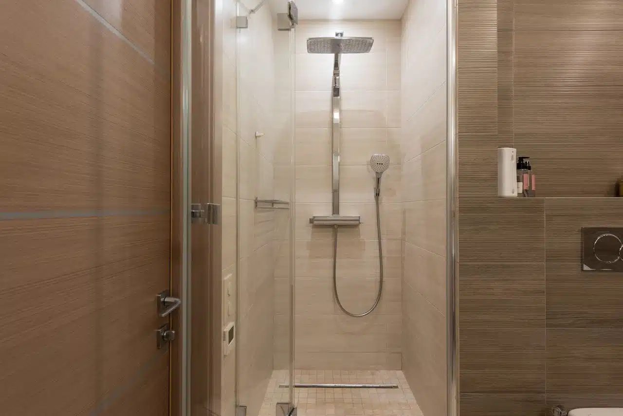 Shower drain and valve area in a bathroom remodel in Estero, Florida