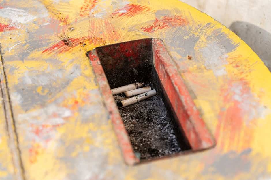 Close-up of garbage disposal splash guard with visible biofilm buildup causing rotten egg odor